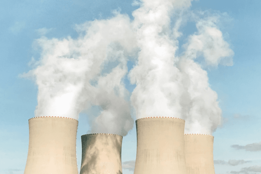 Smoke coming out of the cooling towers at a nuclear pant.